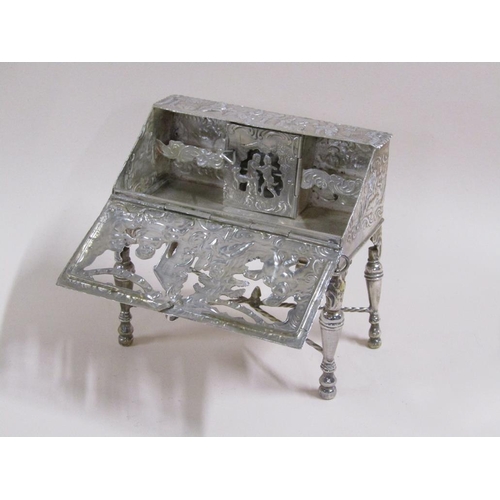 81 - A late 19c Continental silver bureau de dame, chased pierced and embossed with a church and classica... 