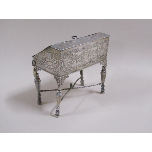 81 - A late 19c Continental silver bureau de dame, chased pierced and embossed with a church and classica... 