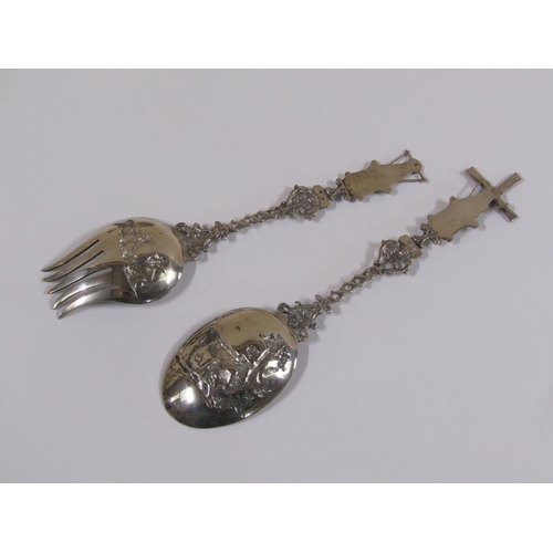 85 - A pair of early 20c Dutch silver decorative table spoons, the bowls embossed and chased with dairy c... 