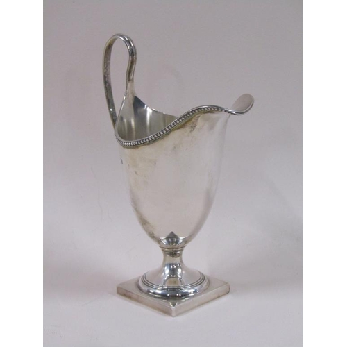 87 - A late Georgian style silver cream jug, London 1966, 3.8ozt, 15.5cm h.