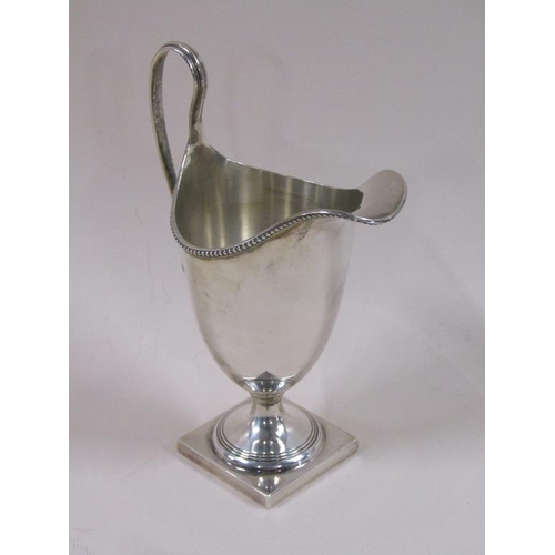 87 - A late Georgian style silver cream jug, London 1966, 3.8ozt, 15.5cm h.