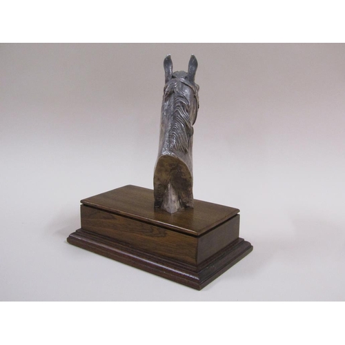 92 - A silver cased horse racing trophy in the form of a horses head, on a mahogany plinth with attached ... 