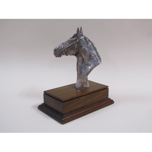 92 - A silver cased horse racing trophy in the form of a horses head, on a mahogany plinth with attached ... 