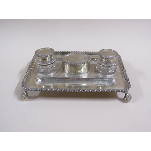 93 - An early 19c silver two bottle ink stand with a central lidded seal box, the stand with two pen tray... 