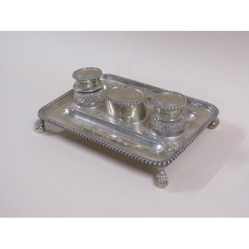 93 - An early 19c silver two bottle ink stand with a central lidded seal box, the stand with two pen tray... 