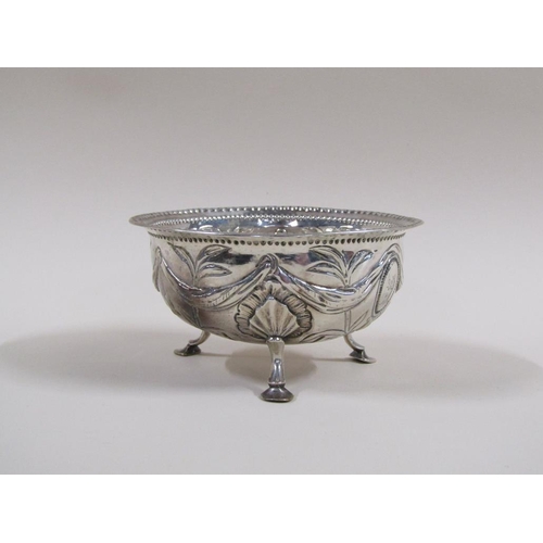 94 - A late Georgian sugar bowl with a parallel beaded upper rim, embossed and chased with garland, bows ... 