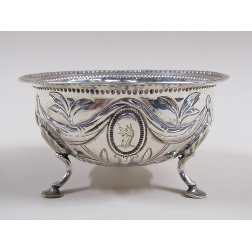 94 - A late Georgian sugar bowl with a parallel beaded upper rim, embossed and chased with garland, bows ... 