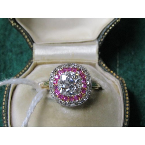 59 - A gold diamond and ruby set ring, the principal stone approx. 1.25carats, size O.