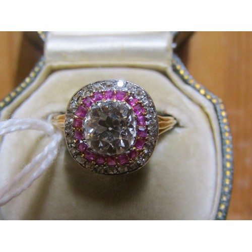 59 - A gold diamond and ruby set ring, the principal stone approx. 1.25carats, size O.