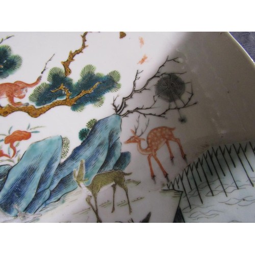 139 - A pair of 19c Chinese famille verte chargers decorated with deer under a pine tree with monkeys and ... 