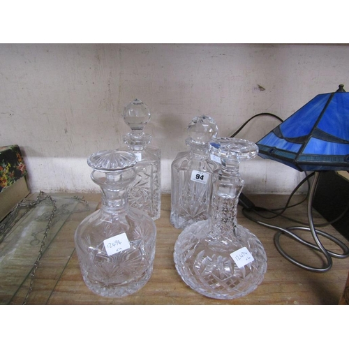 94 - FOUR CRYSTAL DECANTERS AND STOPPERS