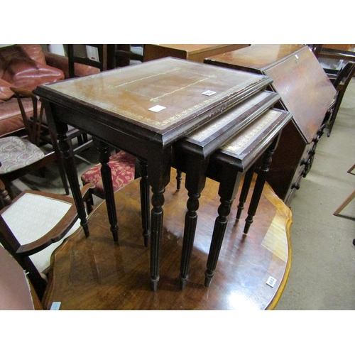 604 - NEST OF THREE LEATHER TOP TABLES