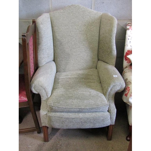 737 - WINGBACKED ARMCHAIR AND A STOOL