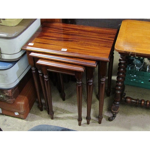 811 - NEST OF THREE MAHOGANY TABLES