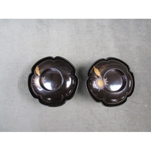 1252 - TWO ORIENTAL BLACK LACQUERED BOWLS AND STANDS, BOWLS 13CM W