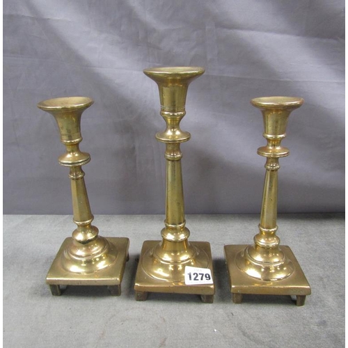 1279 - SET OF THREE ANTIQUE BRASS CANDLESTICKS- LARGEST 25CM H