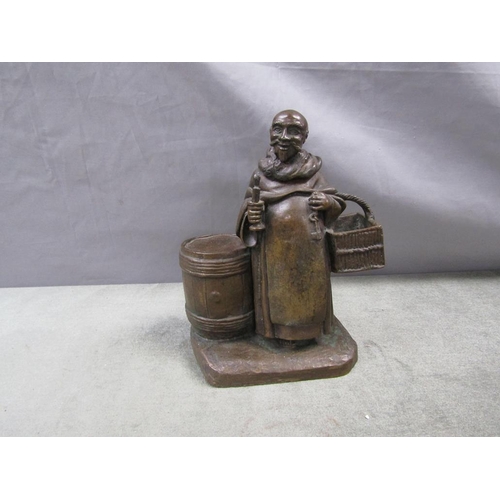 1291 - 19C STYLE BRONZE FIGURE OF A MONK WITH BARREL AND BASKET, 20CM H