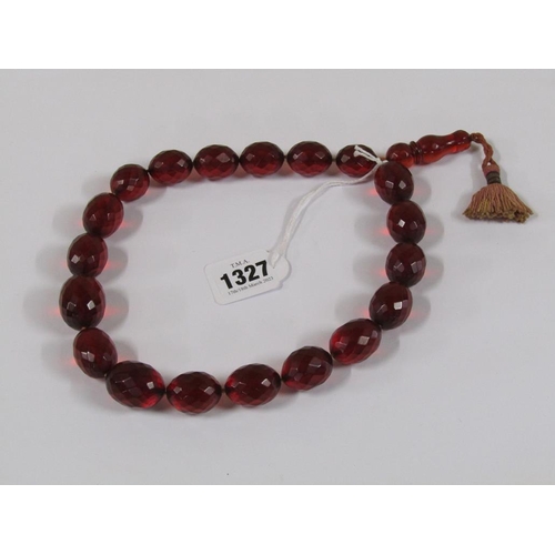 1327 - STRING OF CUT CHERRY AMBER TYPE BEADS, 52CM L