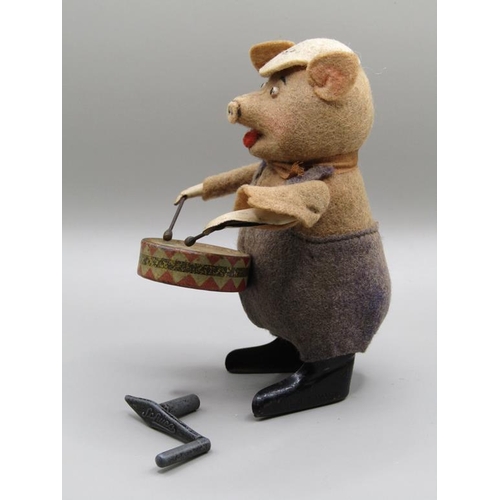 1344 - SCHUCO DRUMMING PIG IN ORIGINAL COSTUME, IN WORKING ORDER, 12CM H