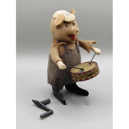 1344 - SCHUCO DRUMMING PIG IN ORIGINAL COSTUME, IN WORKING ORDER, 12CM H