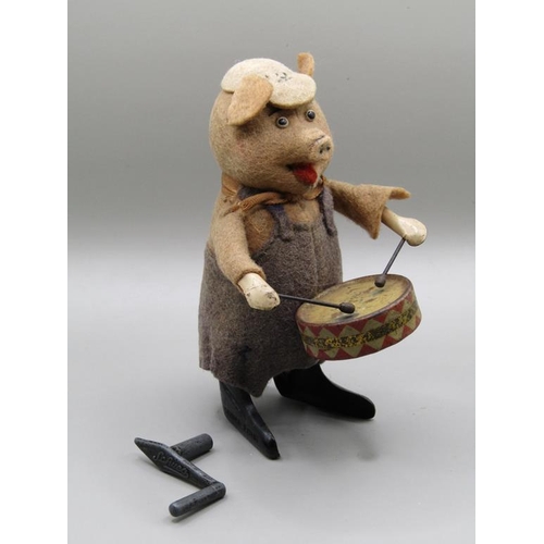 1344 - SCHUCO DRUMMING PIG IN ORIGINAL COSTUME, IN WORKING ORDER, 12CM H