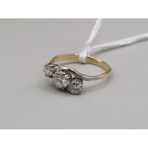 1358 - 18ct GOLD THREE STONE DIAMOND TWIST SET RING SIZE M - CENTRAL STONE APPX 1/2 CT