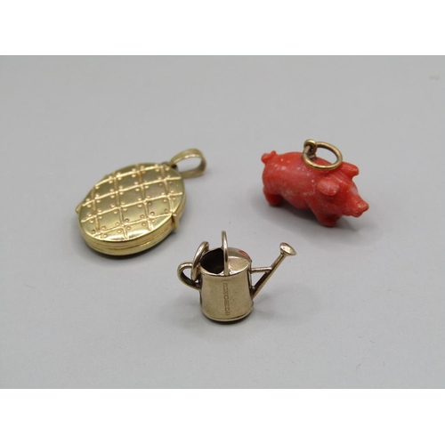 1392 - 9CT GOLD MINIATURE WATERING CAN; PENDANT LOCKET; CARVED CORAL PIG