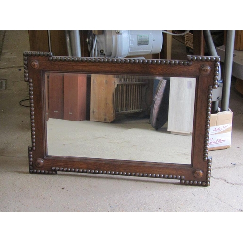 556 - TWO OAK FRAMED MIRRORS