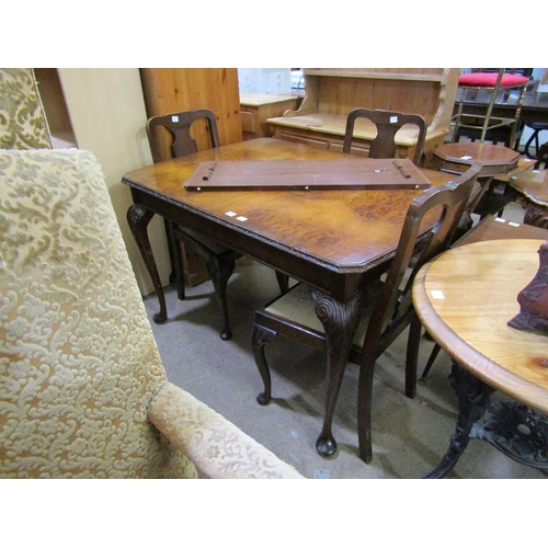 639 - WALNUT VENEERED DINING TABLE AND FOUR CHAIRS