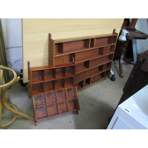 672 - THREE MAHOGANY HANGING SHELVES