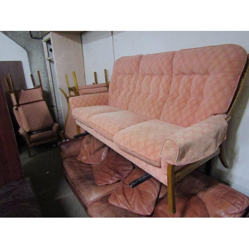 694 - FOUR ARMCHAIRS; THREE SEATER SOFA