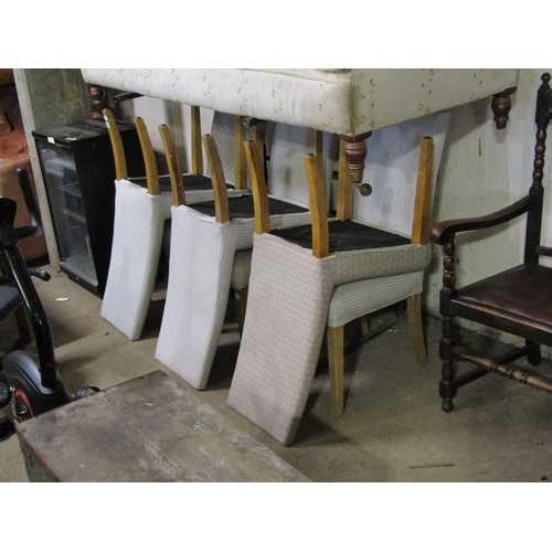 699 - SIX UPHOLSTERED DINING CHAIRS