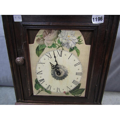 1196 - CARVED OAK CUPBOARD WITH CLOCK PANEL, 54CM H