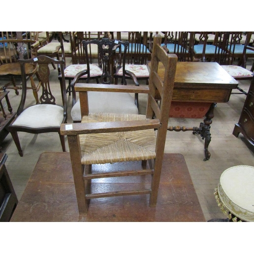 1875 - OAK PLANK TOP LOW TABLE, 84CM W, 47CM H; CHILDS OAK OPEN ARMCHAIR WITH RUSH SEAT