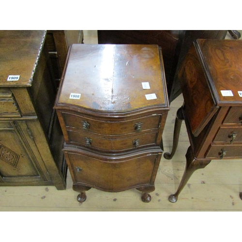 1908 - FIGURE MAHOGANY SERPENTINE FRONTED BEDROOM CABINET FITTED TWO SHORT DRAWERS OVER CUPBOARD. 35CM W, 7... 