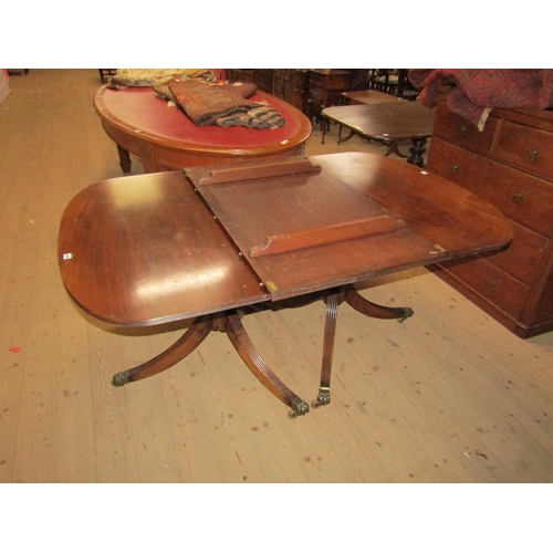 1922 - MAHOGANY REGENCY STYLE TWIN PEDESTAL EXTENDING DINING TABLE