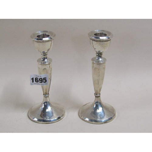 1695 - PAIR OF SILVER CASED CANDLESTICKS, 15cmS H