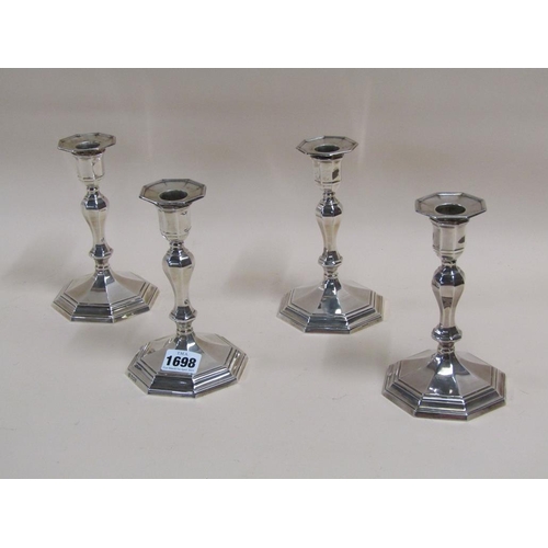 1698 - SET OF FOUR SILVER CASED CANDLESTICKS - 17cms H