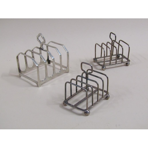 1715 - PAIR OF FOUR DIVSION SILVER TOAST RACKS; ONE LARGER