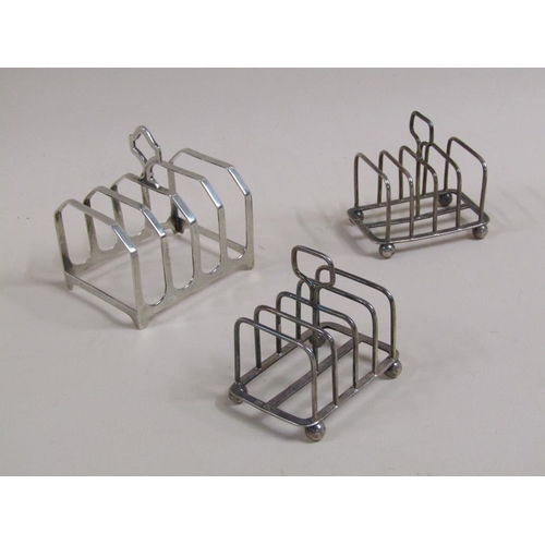 1715 - PAIR OF FOUR DIVSION SILVER TOAST RACKS; ONE LARGER