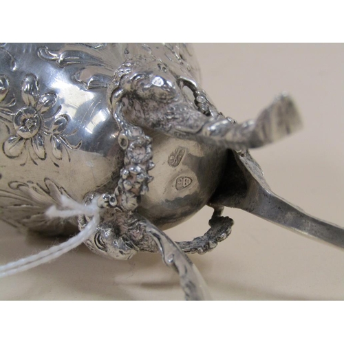 1717 - SILVER EMBOSSED AND CHASED OVOID SHAPED VASE SUPPORTED ON THREE LEGS WITH RAMS HEAD TERMINALS, 10.5C... 