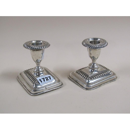 1727 - PAIR OF SHORT SILVER CASED CANDLESTICKS, 8CM H