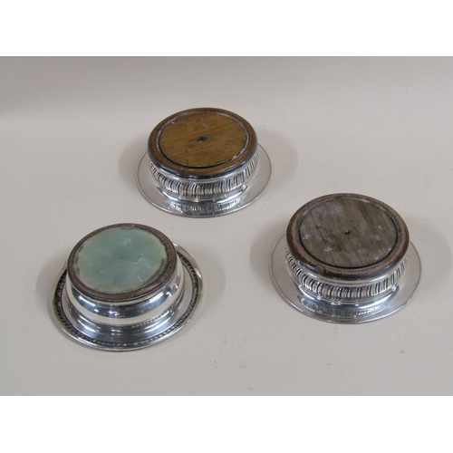 1738 - THREE SILVER PLATED WINE BOTTLE COASTERS WITH TURNED WOODEN BASES, EACH 14.5CM DIAM