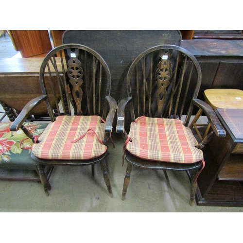 860 - TWO WHEELBACK ARMCHAIRS