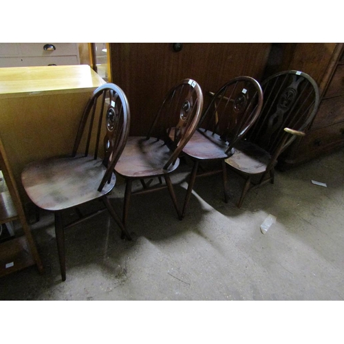 893 - THREE ERCOL DINING CHAIRS AND AN ARMCHAIR