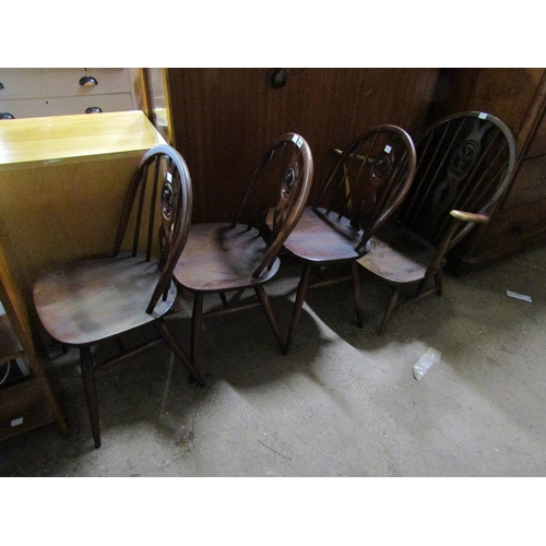 893 - THREE ERCOL DINING CHAIRS AND AN ARMCHAIR