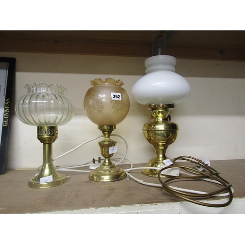 362 - THREE BRASS LAMPS AND SHADES