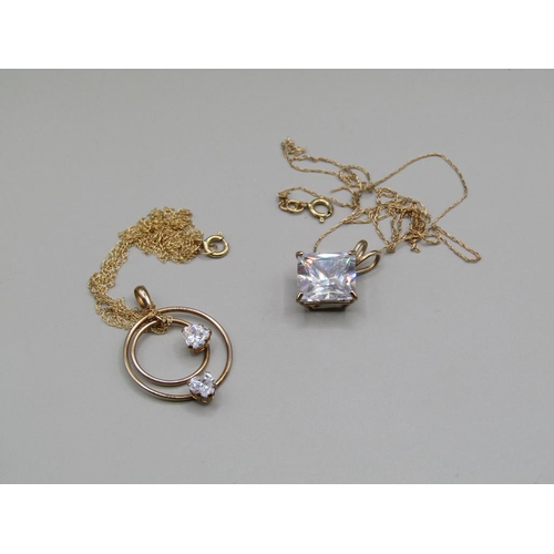 1267 - TWO PENDANTS - GOLD MOUNTED AND GOLD CHAINS