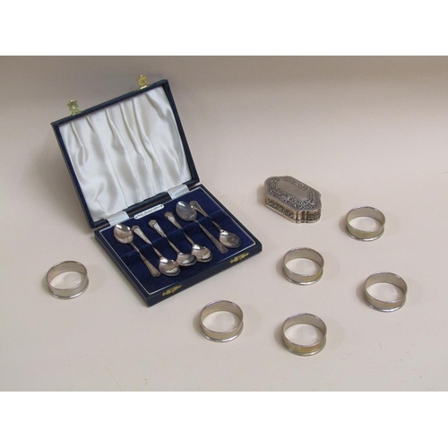 1407 - COLLECTION SIX SILVER NAPKIN RINGS AND A BOX OF SIX SILVER TEASPOONS