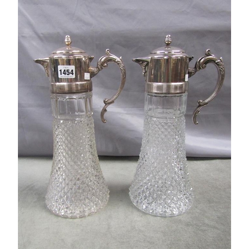 1454 - PAIR OF CAST CLARET JUGS WITH SILVER PLATED MOUNTS